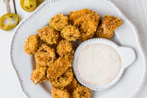 plate of fried keto jalapenos with ranch dip