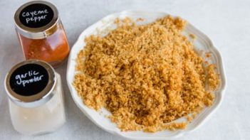 ground pork rinds in a bowl for breading with seasoning