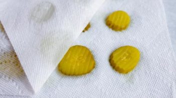 pickles drying on a paper towel