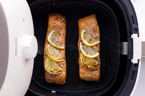 cooked salmon in a air fryer basket
