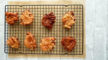 Keto apple fritters cooling on rack