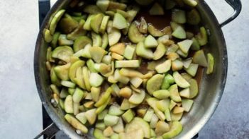 sliced zucchini and chayote in a skillet