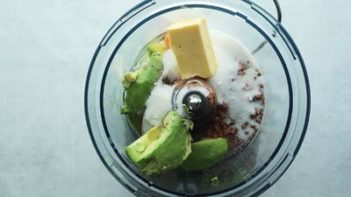avocado and other ingredients in a food processor