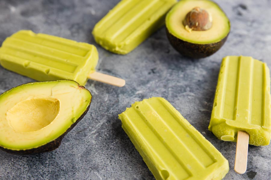 bright green sugar free avocado pops scattered around