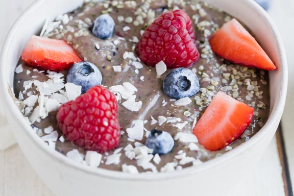 creamy berry smoothie bowl with berries on top