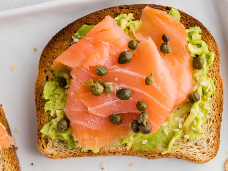 close up of a smoked salmon avocado toast with capers
