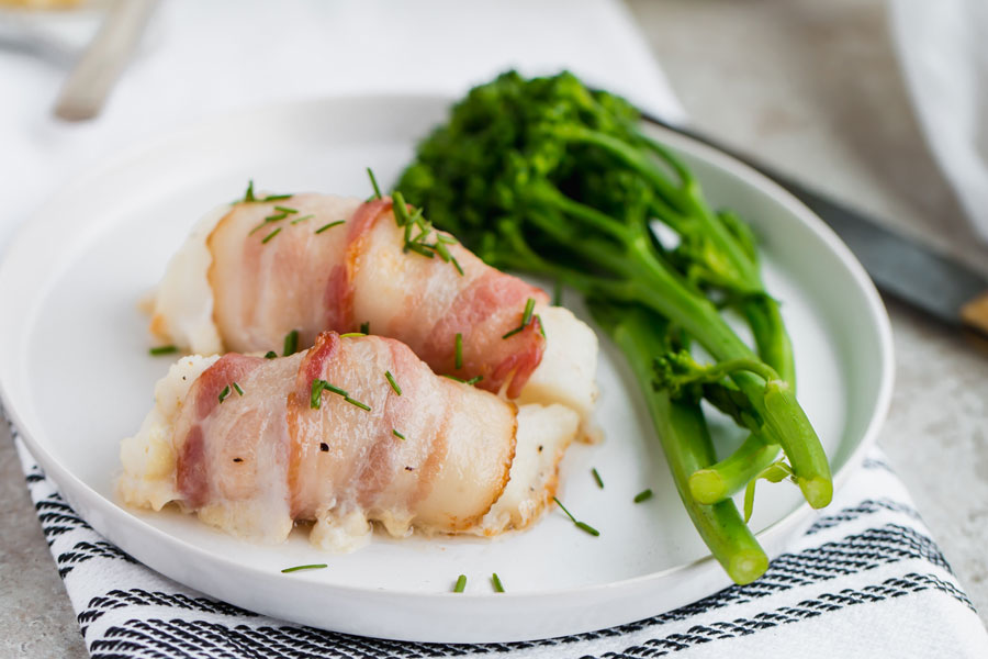 plated bacon wrap cod with greens