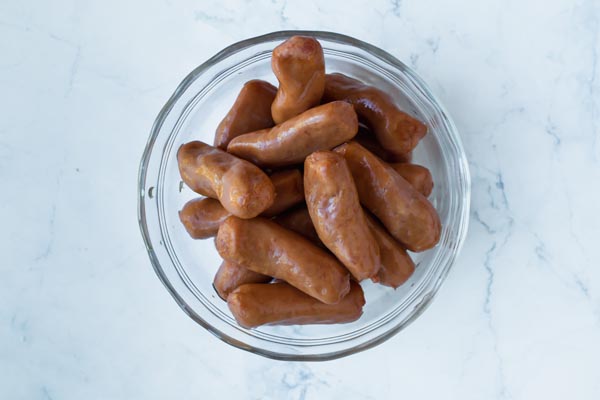 a bowl of cocktail sausages