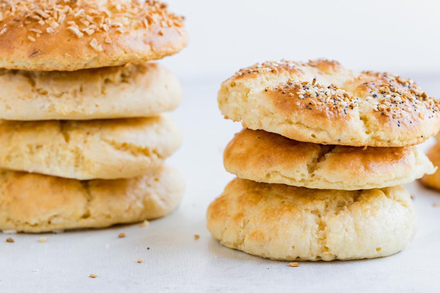 two stacks of bagels one topped with everything bagel seasoning