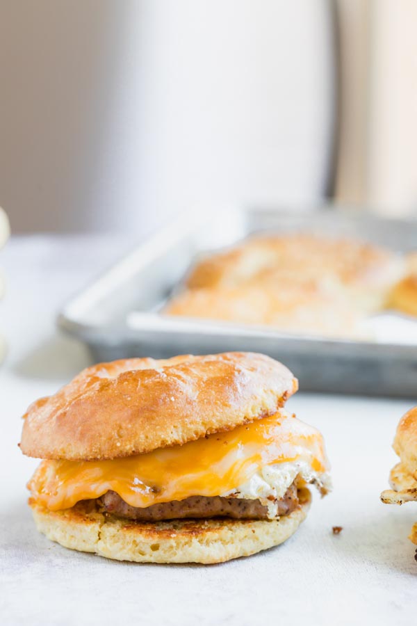 a breakfast bagel sandwich with egg, cheese and sausage