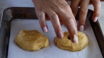 making a hole in the bagel with a finger