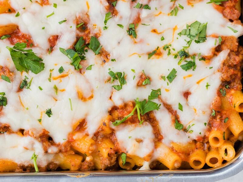A keto baked ziti casserole topped with a meaty red sauce and mozzarella cheese.