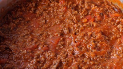 Meaty red sauce with cooked tomatoes.