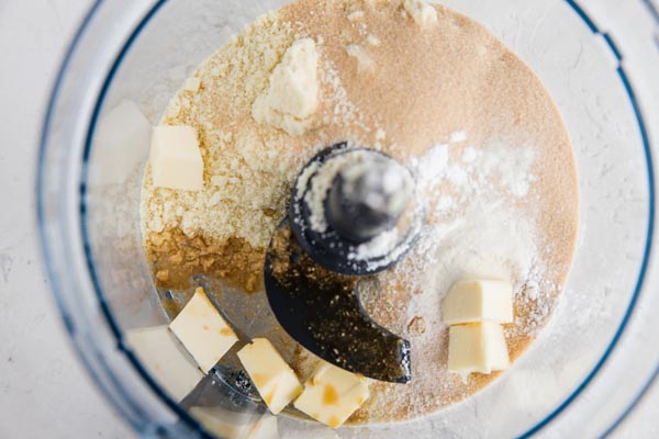 ingredients in a food processor for making banana cream pie crust