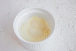 a small ramekin with heavy cream and gelatin inside