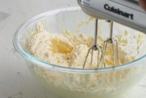 mixing butter and sweetener in a bowl