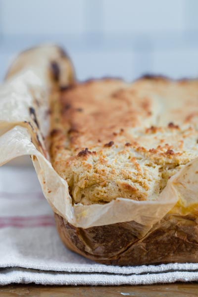 baked egg loaf bread on a towel and wrapped in parchment paper