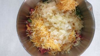 meatloaf ingredients in a large metal bowl