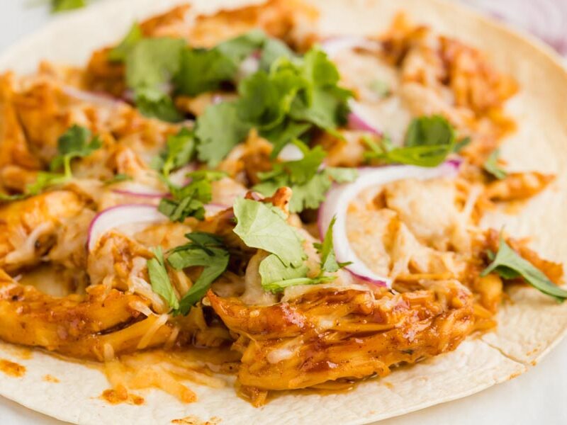bbq chicken tostada topped with cilantro