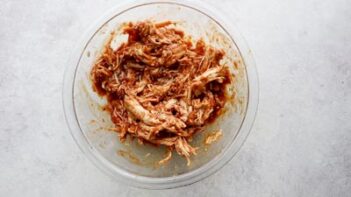 a mixture of shredded bbq chicken in a bowl