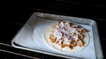 a tostada on a baking tray in the oven