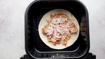 a tostada in an air fryer basket