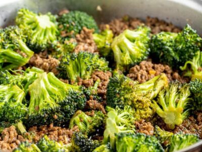 crispy ground beef cooked with broccoli florets in a skillet
