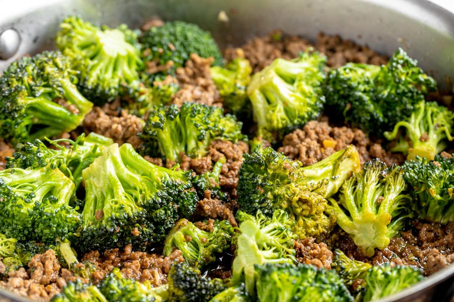 crispy ground beef cooked with broccoli florets in a skillet