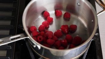 raspberries and water in a medium saucepan on the stove