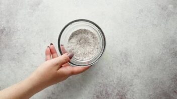 holding a mixture of sugar and thickener ingredients in a bowl