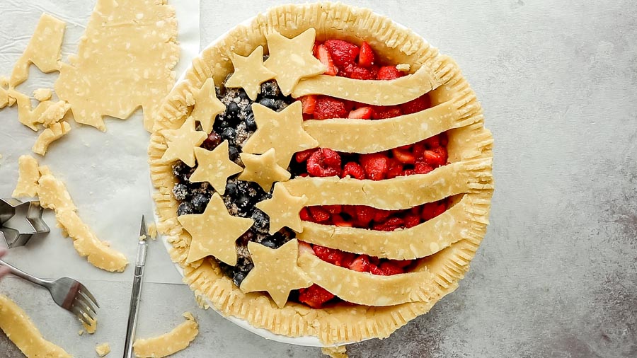 an unbaked pie decorated like an American flag