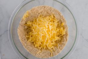 grated butter sitting on the dry ingredients