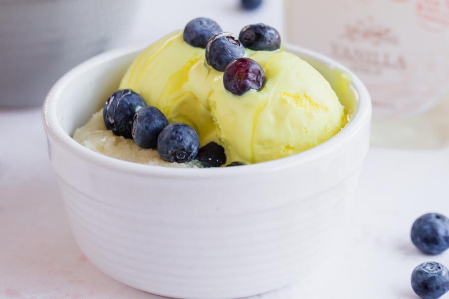 lemon ice cream on top of blueberry shortcake