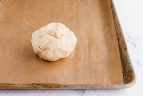keto dough ball on a parchment baking tray
