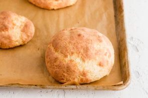 baked low carb bread roll on a parchment paper