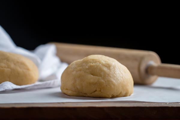 fathead pizza dough in a ball with a black background