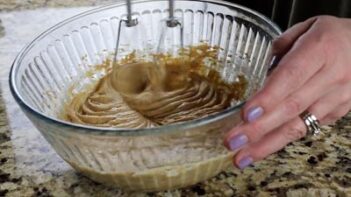 mixing batter in a bowl with an electric mixer
