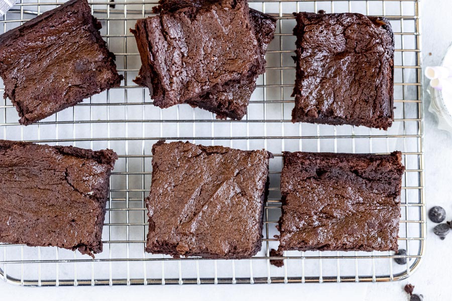 brownies cut into square on a cooling rack