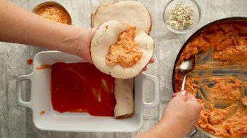 red sauce on the bottom of a baking dish