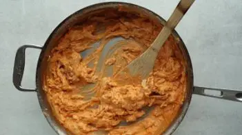 buffalo chicken mixture in a skillet