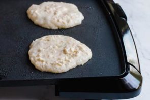 spoon keto pancake batter onto griddle