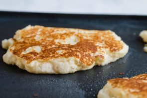 cooking keto pancakes on a griddle