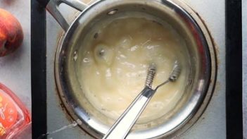 large clear bubbles forming in the candy mixture cooking on a stove