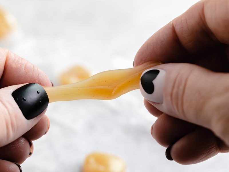 pulling apart a caramel chew