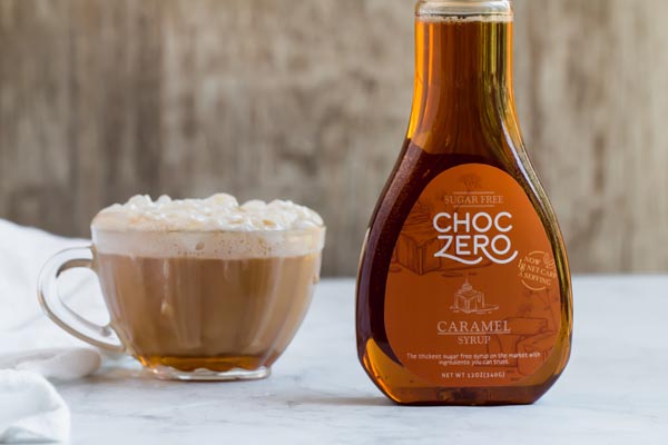 ChocZero caramel syrup next to glass mug