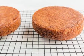 two round cakes on a wire rack