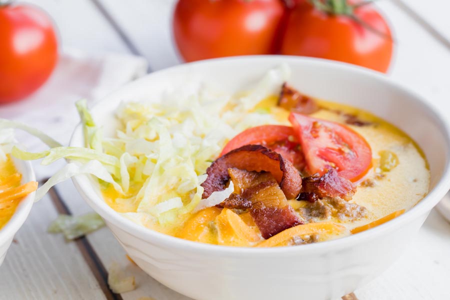 crumbled bacon and tomato slices on to a bowl of soup