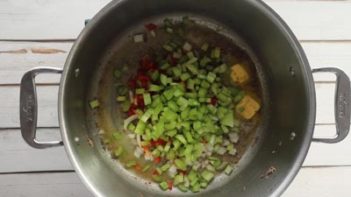 cooking celery and onions in a large pot