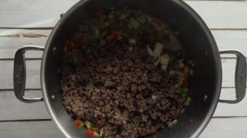 cooked ground beef and veggies in a pot