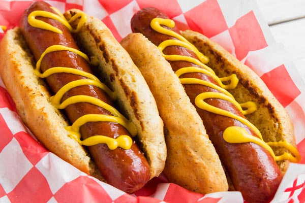 a keto hot dog with mustard on top